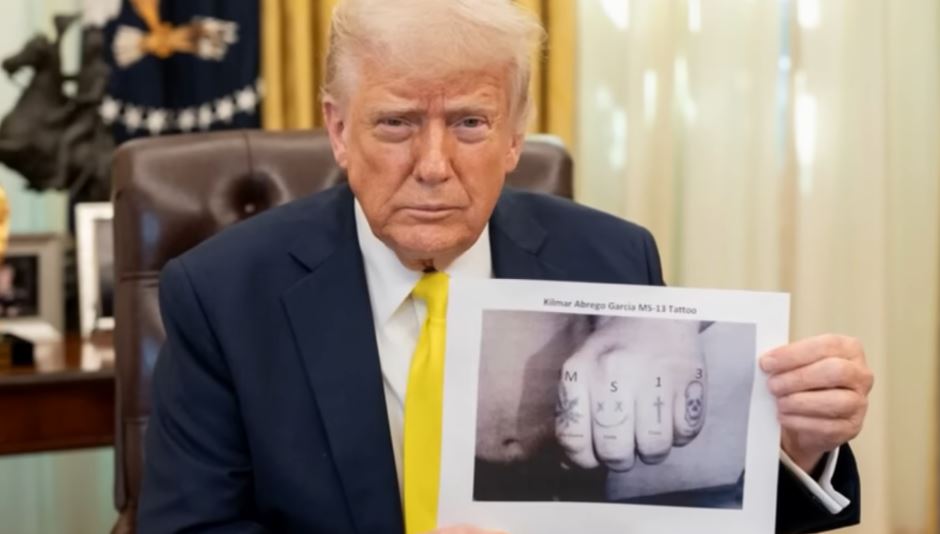 Trump Holds Tattoo Photo